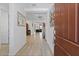 Bright hallway with light tile floors, leading to the home's living spaces at 24878 N 172Nd Dr, Surprise, AZ 85387