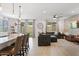 Open-concept living room and kitchen with modern decor and plenty of natural light at 24878 N 172Nd Dr, Surprise, AZ 85387