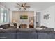 Spacious living room featuring a large sectional and media console for relaxing and entertainment at 24878 N 172Nd Dr, Surprise, AZ 85387