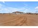 Vast backyard with a single story home and long driveway at 28834 N 175Th Ave, Surprise, AZ 85387