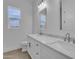Bright bathroom featuring a double vanity with marble countertop and modern fixtures at 28834 N 175Th Ave, Surprise, AZ 85387