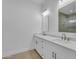 Bathroom featuring double sinks, marble countertops, updated cabinets, modern fixtures, and tile floors at 28834 N 175Th Ave, Surprise, AZ 85387