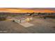 Single-story home featuring a clean white facade, modern garage door, and long concrete driveway at 28834 N 175Th Ave, Surprise, AZ 85387