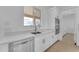 Sleek kitchen featuring white cabinets, stainless steel appliances, and a modern sink at 28834 N 175Th Ave, Surprise, AZ 85387