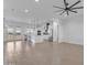 Bright, open-concept living space with modern ceiling fan and views of the backyard at 28834 N 175Th Ave, Surprise, AZ 85387