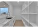 Pantry features built-in shelving, marble counters, and natural light at 28834 N 175Th Ave, Surprise, AZ 85387