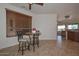 Bright dining area with a round table, tile flooring, and a large window at 3134 N 158Th Ave, Goodyear, AZ 85395