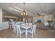 Open-concept living space with tile flooring, a dining area, and views of the kitchen at 3134 N 158Th Ave, Goodyear, AZ 85395