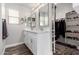 Bright bathroom featuring double sinks, neutral color palette and closet at 3423 E Crescent Way, Gilbert, AZ 85298