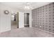 This room features carpet, a ceiling fan and patterned accent wall at 3423 E Crescent Way, Gilbert, AZ 85298