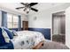 This bedroom features carpet, a ceiling fan and a window at 3423 E Crescent Way, Gilbert, AZ 85298