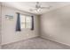 Neutral bedroom offering natural light, carpet floors, and ceiling fan at 3423 E Crescent Way, Gilbert, AZ 85298