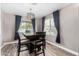 Cozy dining area with wood table, stylish curtains, and natural light, perfect for Gathering meals at 3423 E Crescent Way, Gilbert, AZ 85298
