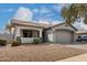 Beautiful single-story home with a large garage, tiled roof, desert landscaping, and a charming front porch at 3423 E Crescent Way, Gilbert, AZ 85298