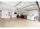 Spacious garage featuring epoxy flooring, storage, and garage door opener at 3423 E Crescent Way, Gilbert, AZ 85298