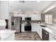 Charming kitchen featuring stainless steel appliances, white cabinets and marbled countertops at 3423 E Crescent Way, Gilbert, AZ 85298