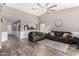 Bright and airy living room with hardwood floors, comfortable seating, and an open layout at 3423 E Crescent Way, Gilbert, AZ 85298