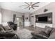 Inviting living room with hardwood floors, plush seating, and a view of the outdoor patio at 3423 E Crescent Way, Gilbert, AZ 85298