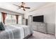 Well-lit bedroom with plush carpet, a neutral color palette, and generous natural light at 3423 E Crescent Way, Gilbert, AZ 85298