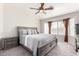 Comfortable bedroom featuring a king-size bed, neutral decor, and a cozy ceiling fan at 3423 E Crescent Way, Gilbert, AZ 85298