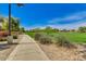 Paved walking path through the community, surrounded by mature trees and green spaces at 3423 E Crescent Way, Gilbert, AZ 85298