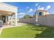 Picture of home's backyard with outdoor seating under a covered patio, and a lush green lawn at 3439 E Shannon St, Gilbert, AZ 85295