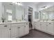 Luxurious bathroom featuring dual sinks, vanity, and a walk-in closet at 3439 E Shannon St, Gilbert, AZ 85295
