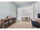 Neutral-toned bedroom featuring an open doorway to a living area with modern decor at 3439 E Shannon St, Gilbert, AZ 85295