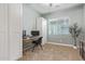 Bright bedroom with a modern desk, stylish chair, and view to the outside with natural lighting at 3439 E Shannon St, Gilbert, AZ 85295
