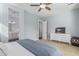 Bright bedroom with a TV, dresser, and en-suite bathroom at 3439 E Shannon St, Gilbert, AZ 85295