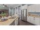 Well-equipped kitchen with stainless steel refrigerator and ample storage space at 3439 E Shannon St, Gilbert, AZ 85295