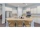Spacious kitchen with stainless steel appliances and a large central island with seating at 3439 E Shannon St, Gilbert, AZ 85295