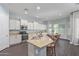 Open kitchen layout with modern appliances and view of a dining area at 3439 E Shannon St, Gilbert, AZ 85295