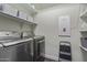 Laundry room featuring modern washer and dryer with shelving and equipment at 3439 E Shannon St, Gilbert, AZ 85295