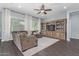 Spacious living room showcasing a sectional sofa and built-in shelving with a TV at 3439 E Shannon St, Gilbert, AZ 85295