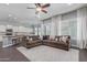 Bright living room and kitchen with a large sectional sofa and ample natural light at 3439 E Shannon St, Gilbert, AZ 85295