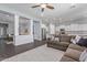 Open-concept living room featuring a comfortable sofa and views of the kitchen at 3439 E Shannon St, Gilbert, AZ 85295