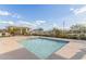 Community spa and pool area with lounge chairs, greenery, and shaded picnic tables at 3439 E Shannon St, Gilbert, AZ 85295