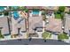 Aerial view of property showcasing lush landscaping, backyard pools and desert surroundings at 3925 E Vallejo Dr, Gilbert, AZ 85298