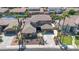 Expansive home featuring mature landscaping, a three-car garage, and a sparkling backyard pool at 3925 E Vallejo Dr, Gilbert, AZ 85298