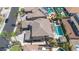 Aerial view of house with tile roof, mature landscaping, and backyard pool and spa at 3925 E Vallejo Dr, Gilbert, AZ 85298