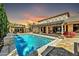Resort-style backyard featuring a pergola, pool, and covered patio, perfect for outdoor living at 3925 E Vallejo Dr, Gilbert, AZ 85298