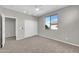 Bedroom with gray walls, a large window and closet space for storage at 3925 E Vallejo Dr, Gilbert, AZ 85298