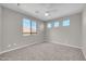 Bedroom featuring carpet flooring, a ceiling fan, and a large window with natural light at 3925 E Vallejo Dr, Gilbert, AZ 85298