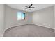 Bedroom featuring neutral carpet, ceiling fan and a large window at 3925 E Vallejo Dr, Gilbert, AZ 85298