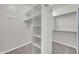 Organized walk-in closet featuring shelving and hanging rods for ample storage at 3925 E Vallejo Dr, Gilbert, AZ 85298
