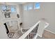 Spacious foyer with a decorative chandelier, tile flooring, and an open staircase at 3925 E Vallejo Dr, Gilbert, AZ 85298