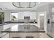 Modern kitchen with stainless steel appliances, granite countertops, and an abundance of cabinet space at 3925 E Vallejo Dr, Gilbert, AZ 85298