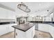 Large kitchen featuring granite countertops, white cabinets and stainless steel appliances at 3925 E Vallejo Dr, Gilbert, AZ 85298