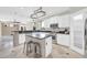 Bright, modern kitchen featuring white cabinets, stainless steel appliances, and a center island with seating at 3925 E Vallejo Dr, Gilbert, AZ 85298